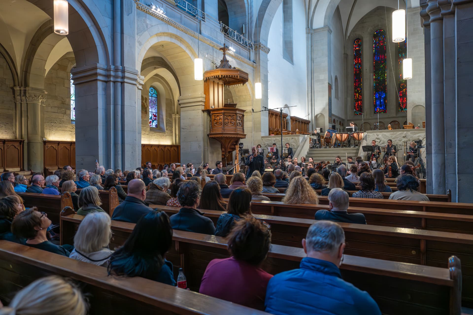 Concert introduction before an audience in the church space
